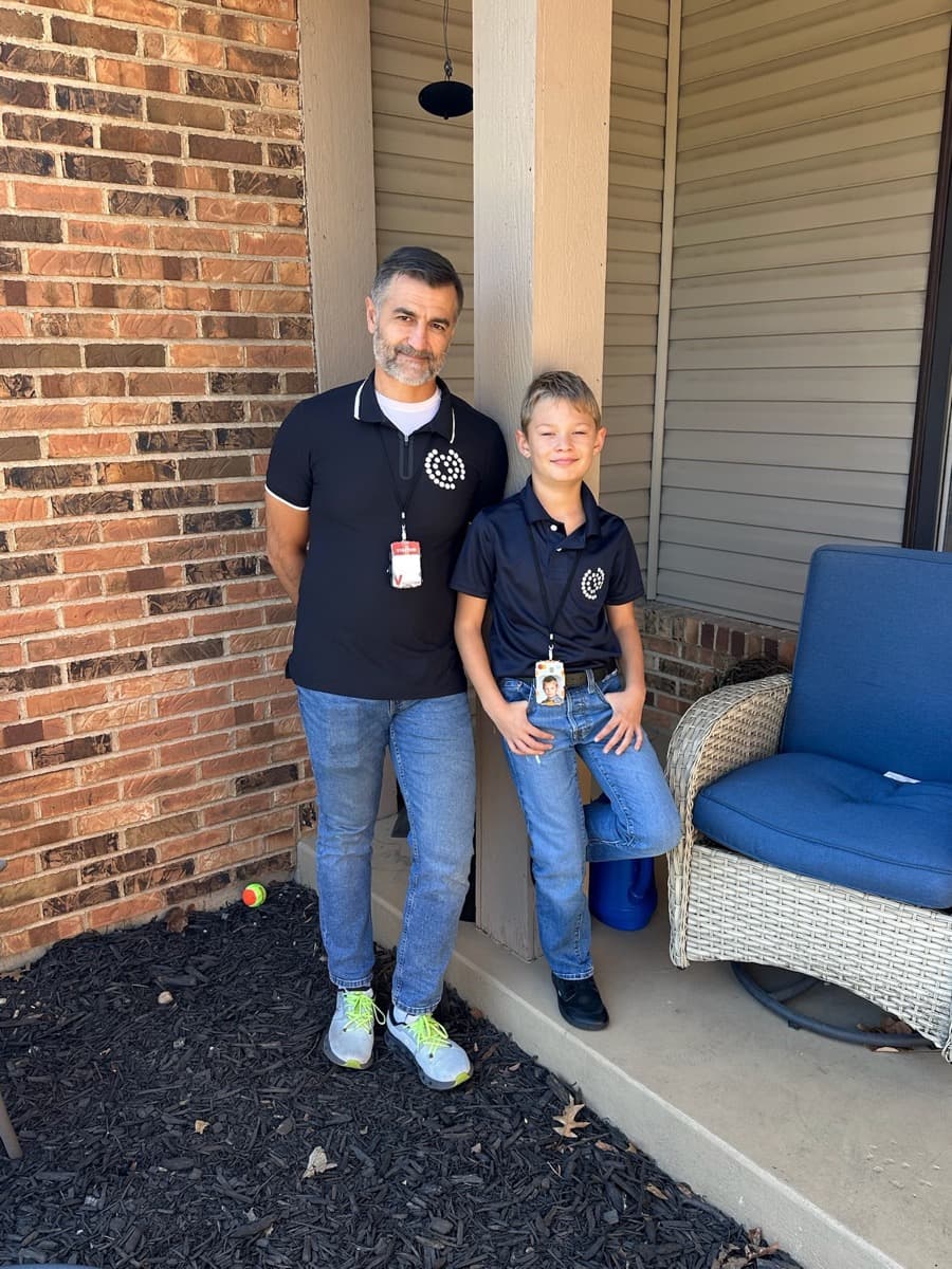 Timothy and his son in matching 81 and Sons polos